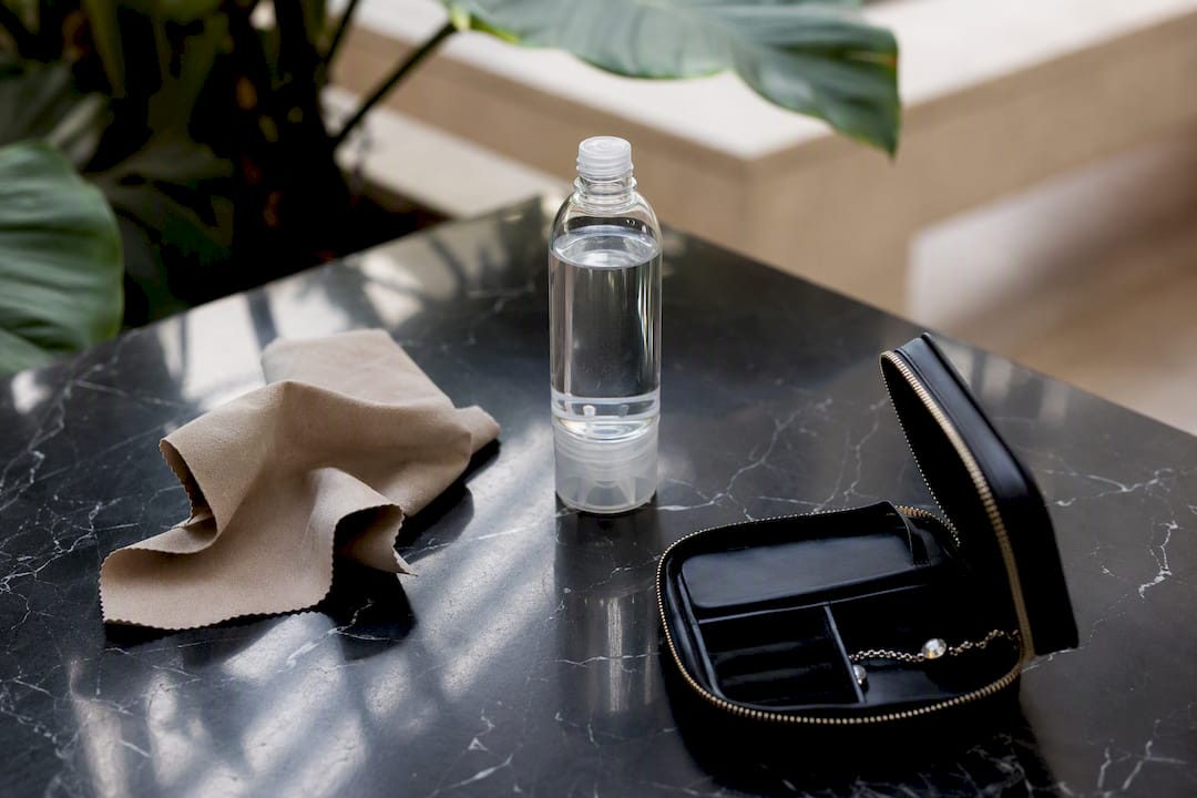 Travel distilled water bottle and jewelry cleaning kit
