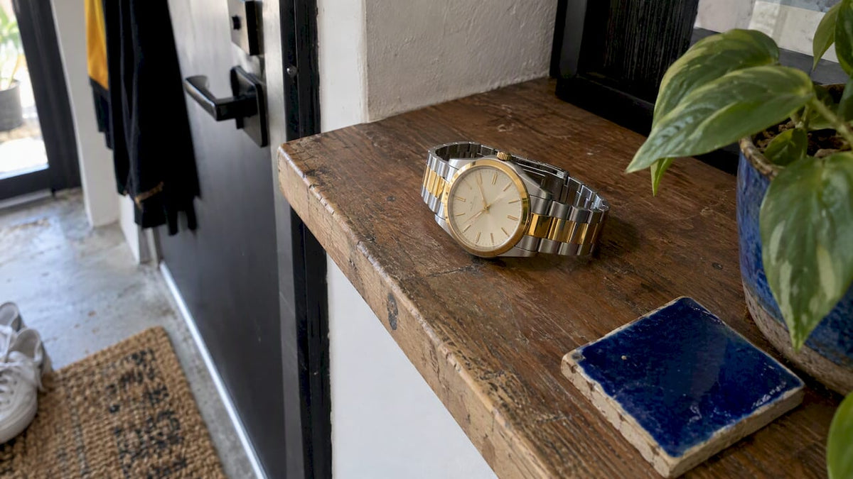 Two-tone watch with steel and gold accents