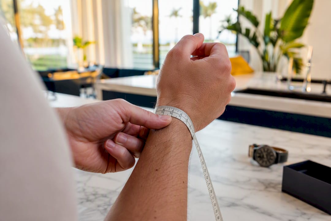 Close-up of wrist being measured with tape