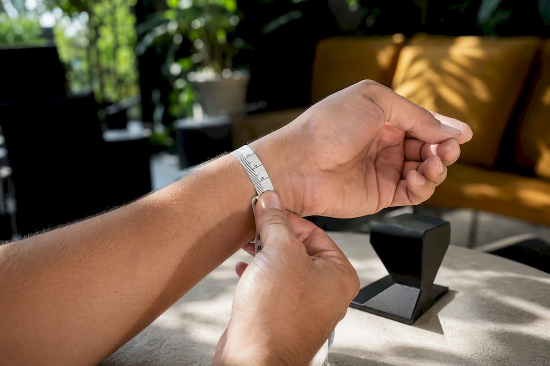 Close-up of wrist measured with tape