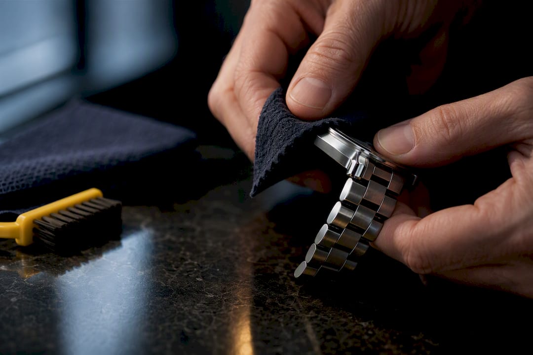 Hands cleaning stainless steel watch edge