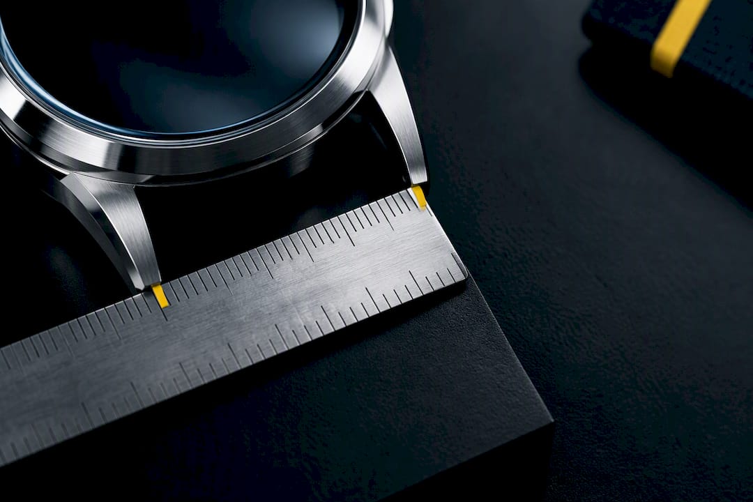 Ruler measuring distance between watch lugs